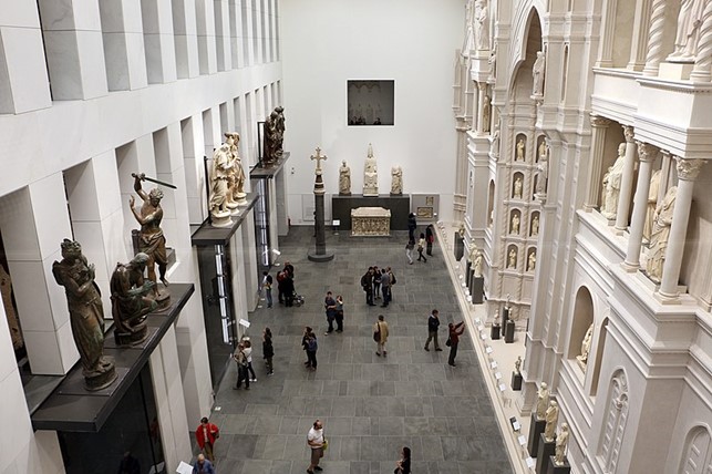 One of the rooms of the Museo dell’Opera del Duomo, with the cathedral façade which was never built on the right, and the three cases protecting the original baptistry doors on the left.